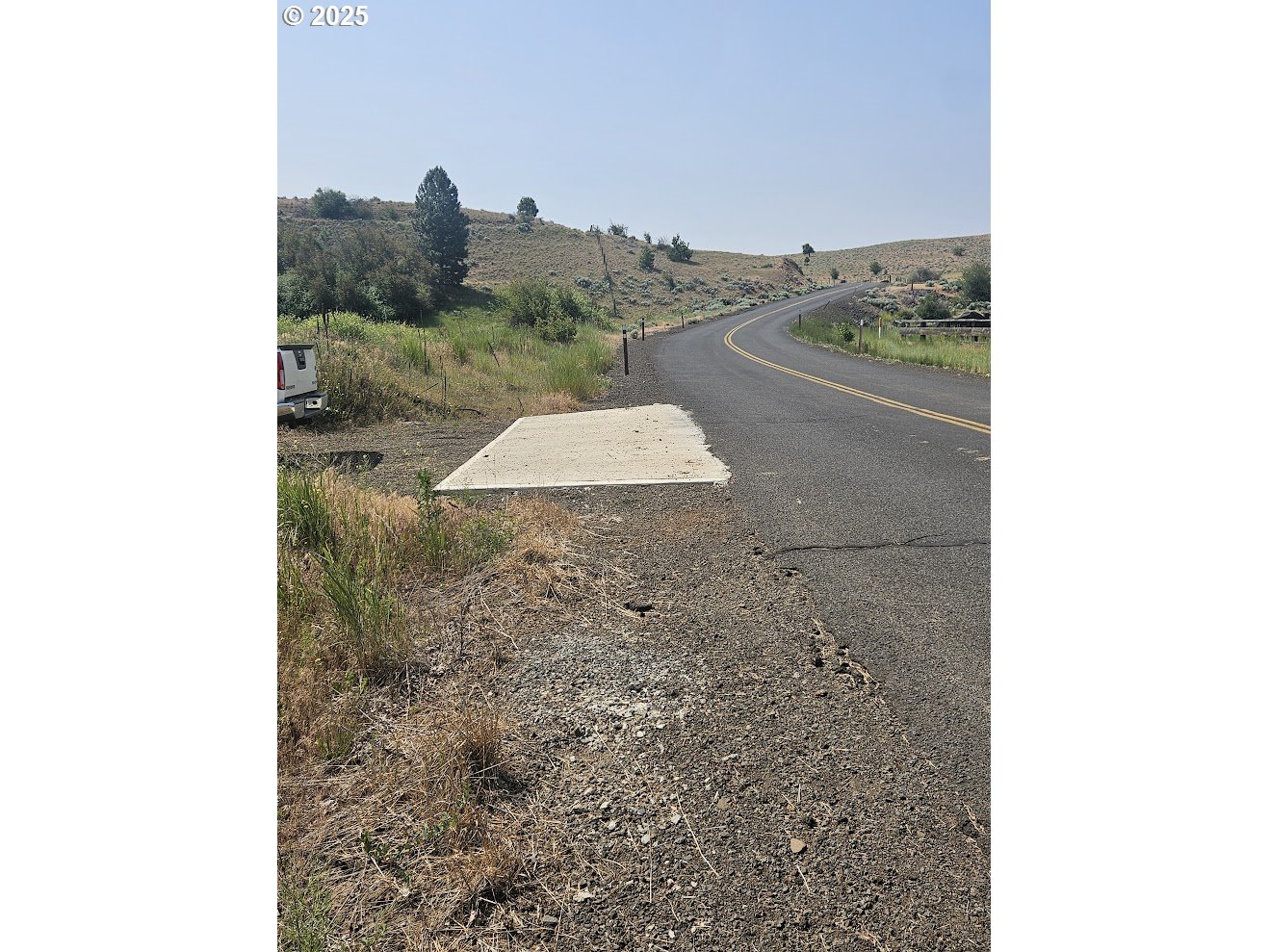 Olson Road Centerville, WA 98613 - Photo 20 of 24 a view of a dry yard with mountains in the background