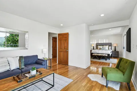 a living room with furniture and a table
