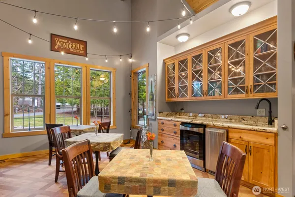 a view of a dining room with furniture window and outside view