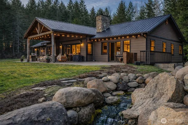 a view of a house with a yard balcony and patio