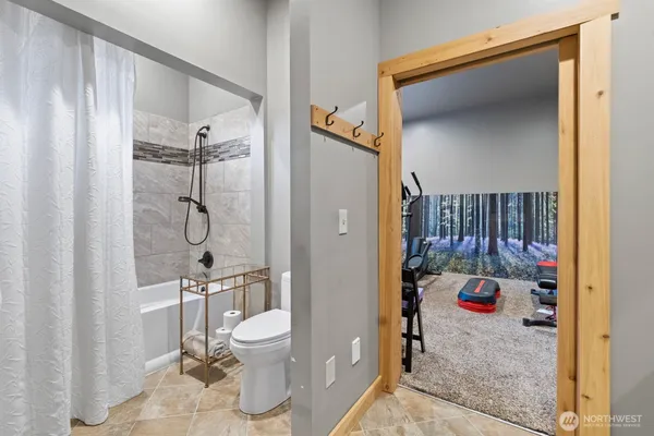 a room with gym equipment and a large window