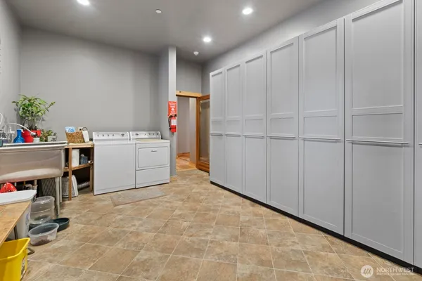 a garage with a wooden floor and a sink