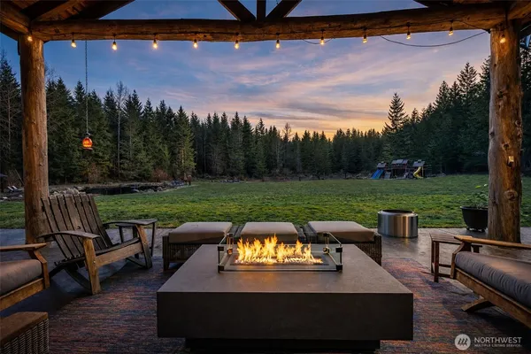 a view of a patio with chairs and a table