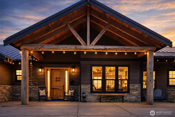 a front view of a house with a large window