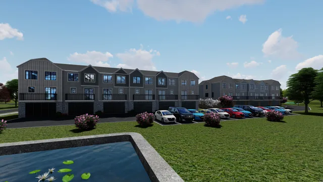 a front view of residential houses with yard