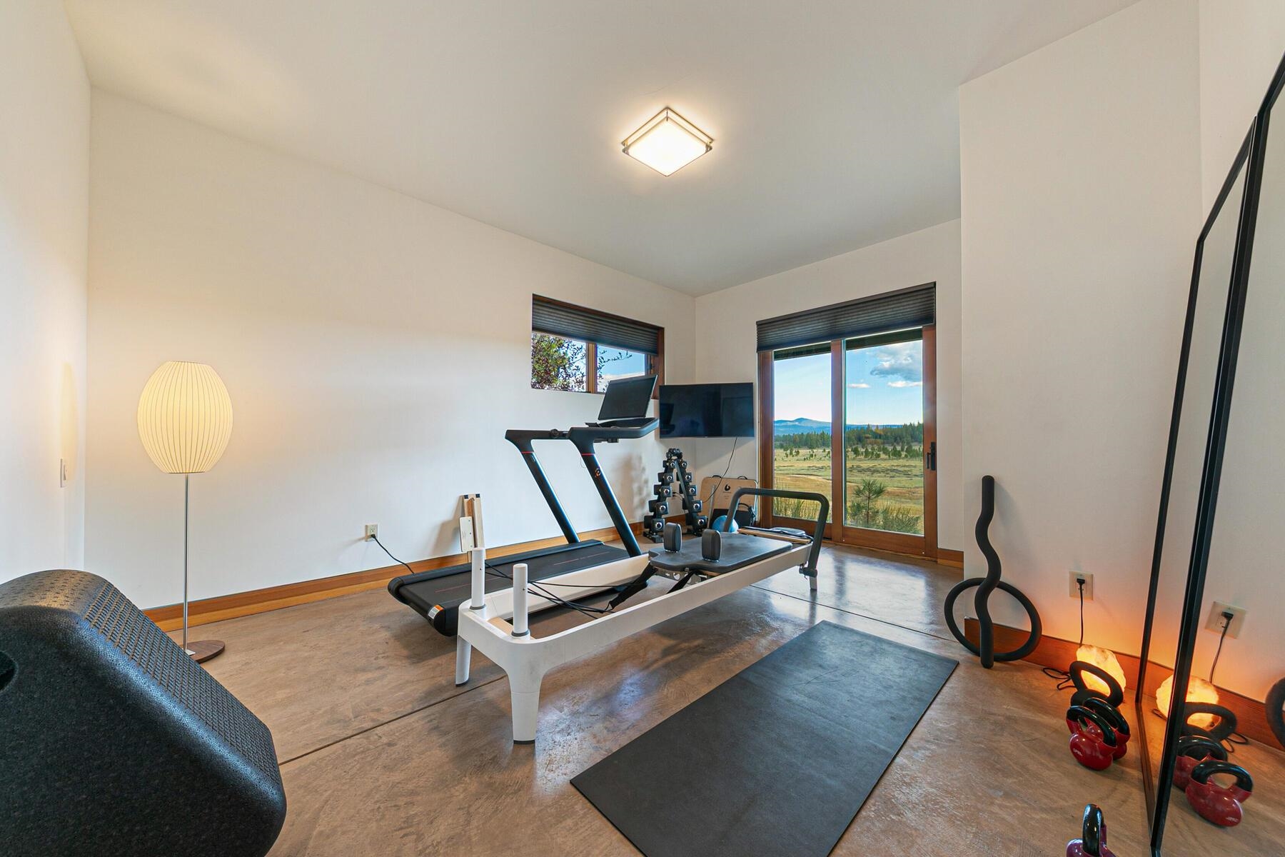 14761 Dry Creek Court Truckee, CA 96161 - Photo 7 of 28 a room with gym equipment and a large window