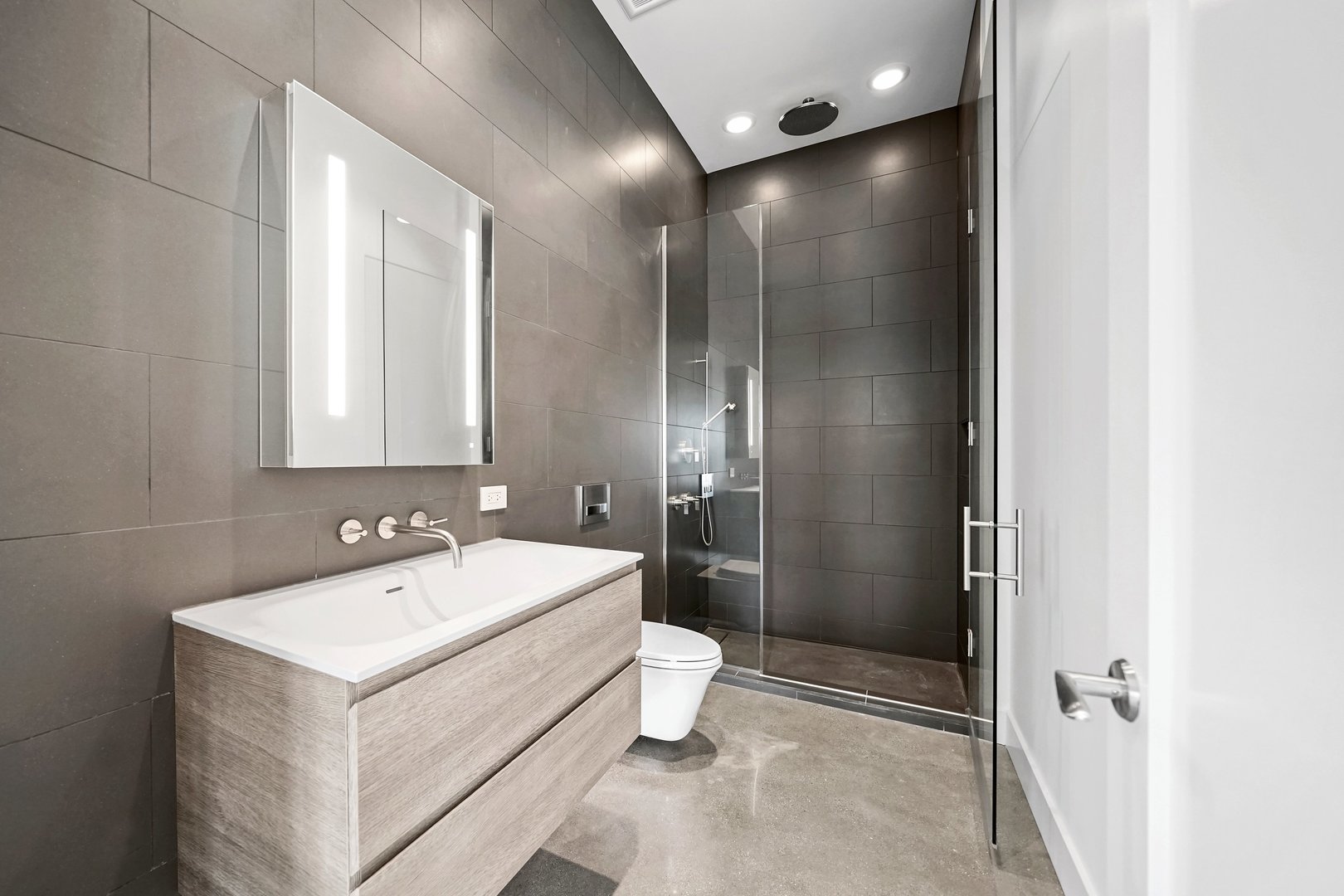 900 West Washington Boulevard, Unit 901 Chicago, IL 60607 - Photo 18 of 20 a bathroom with a sink toilet and shower