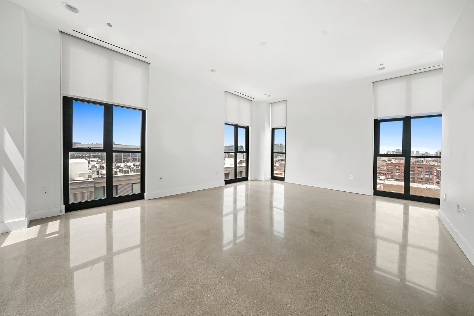900 West Washington Boulevard, Unit 901 Chicago, IL 60607 - Photo 2 of 20 a view of an empty room with window and wooden floor