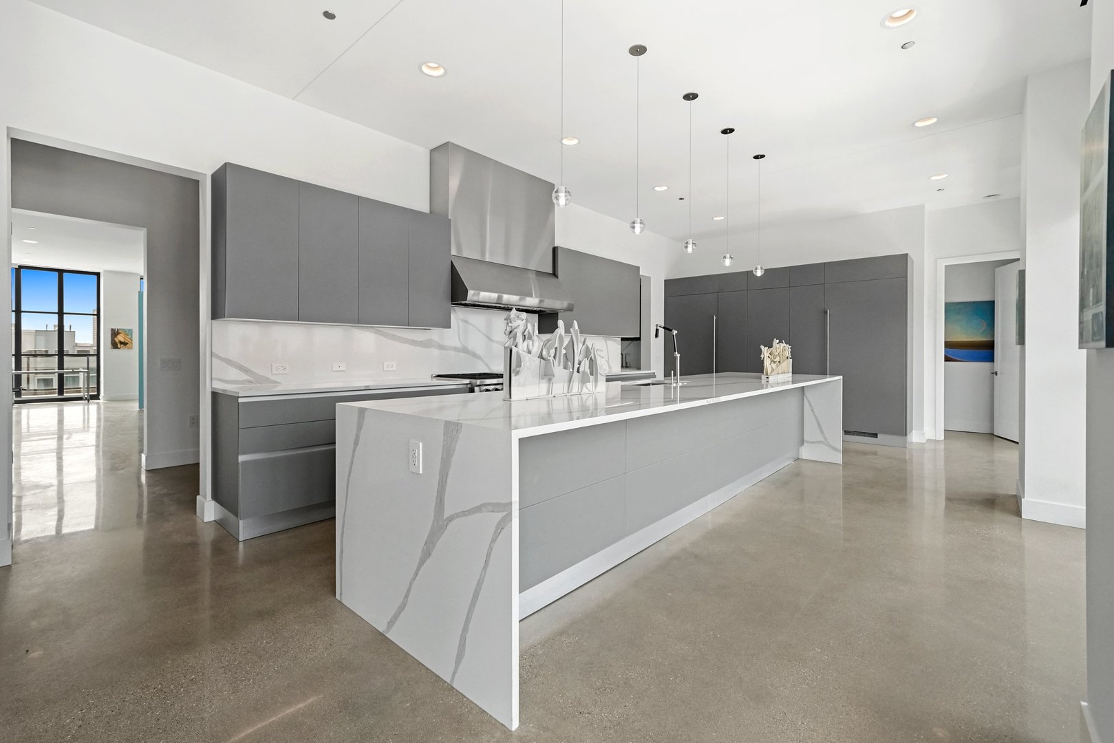 900 West Washington Boulevard, Unit 901 Chicago, IL 60607 - Photo 4 of 20 a kitchen with a sink stainless steel appliances and cabinets