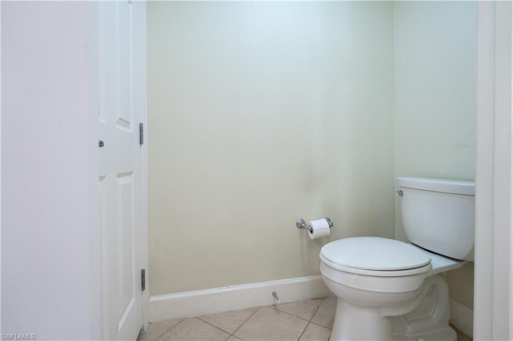 1362 Centre Ct Ridge Drive, Unit 101 Reunion, FL 34747 - Photo 18 of 25 Bathroom with tile flooring and toilet
