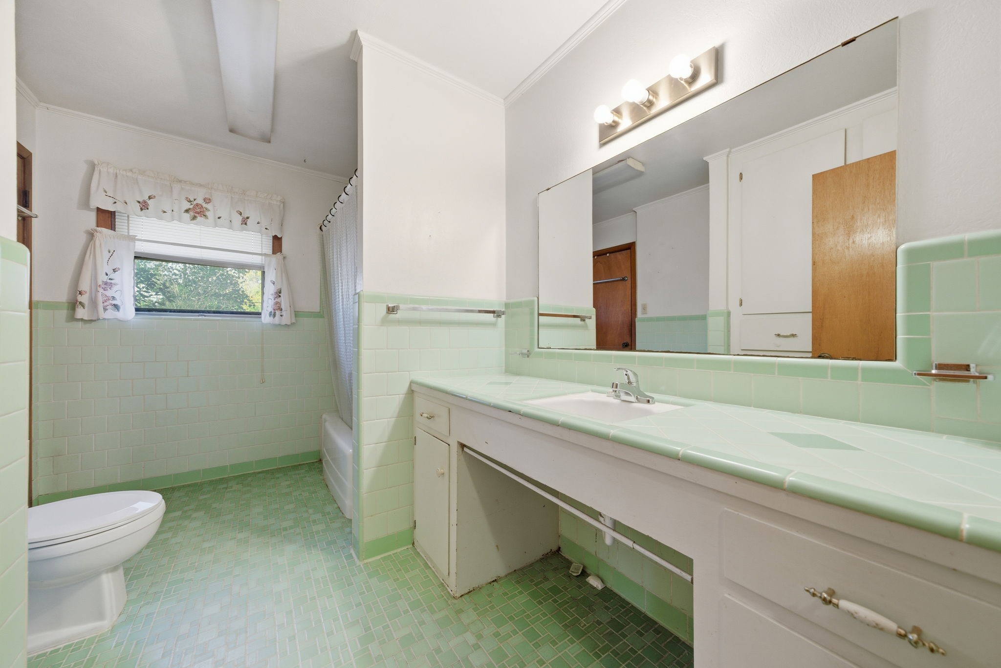 211 Frances Street Cleveland, TX 77328 - Photo 11 of 21 a bathroom with a granite countertop sink a toilet and a mirror