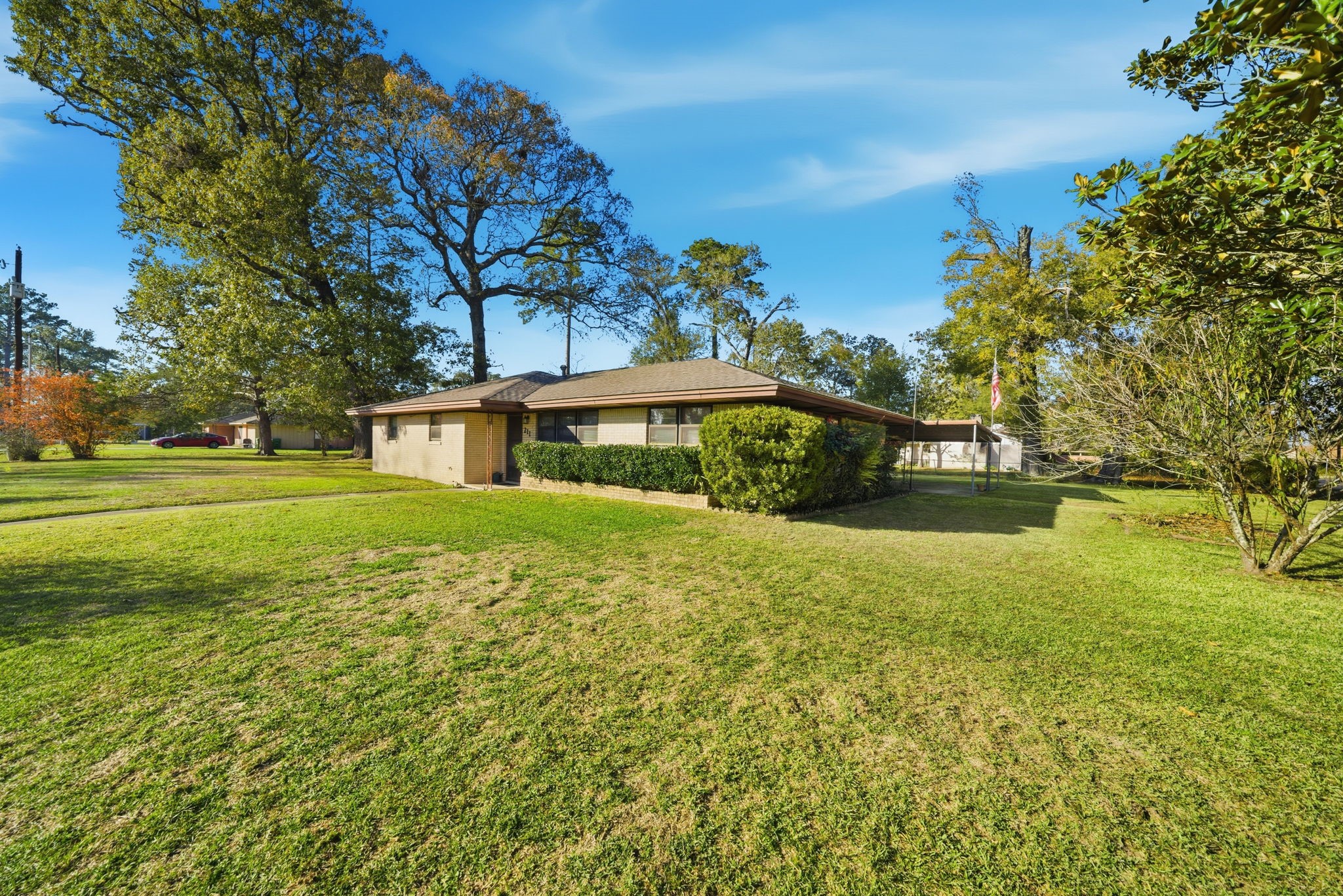 211 Frances Street Cleveland, TX 77328 - Photo 2 of 21 a front view of a house with a yard