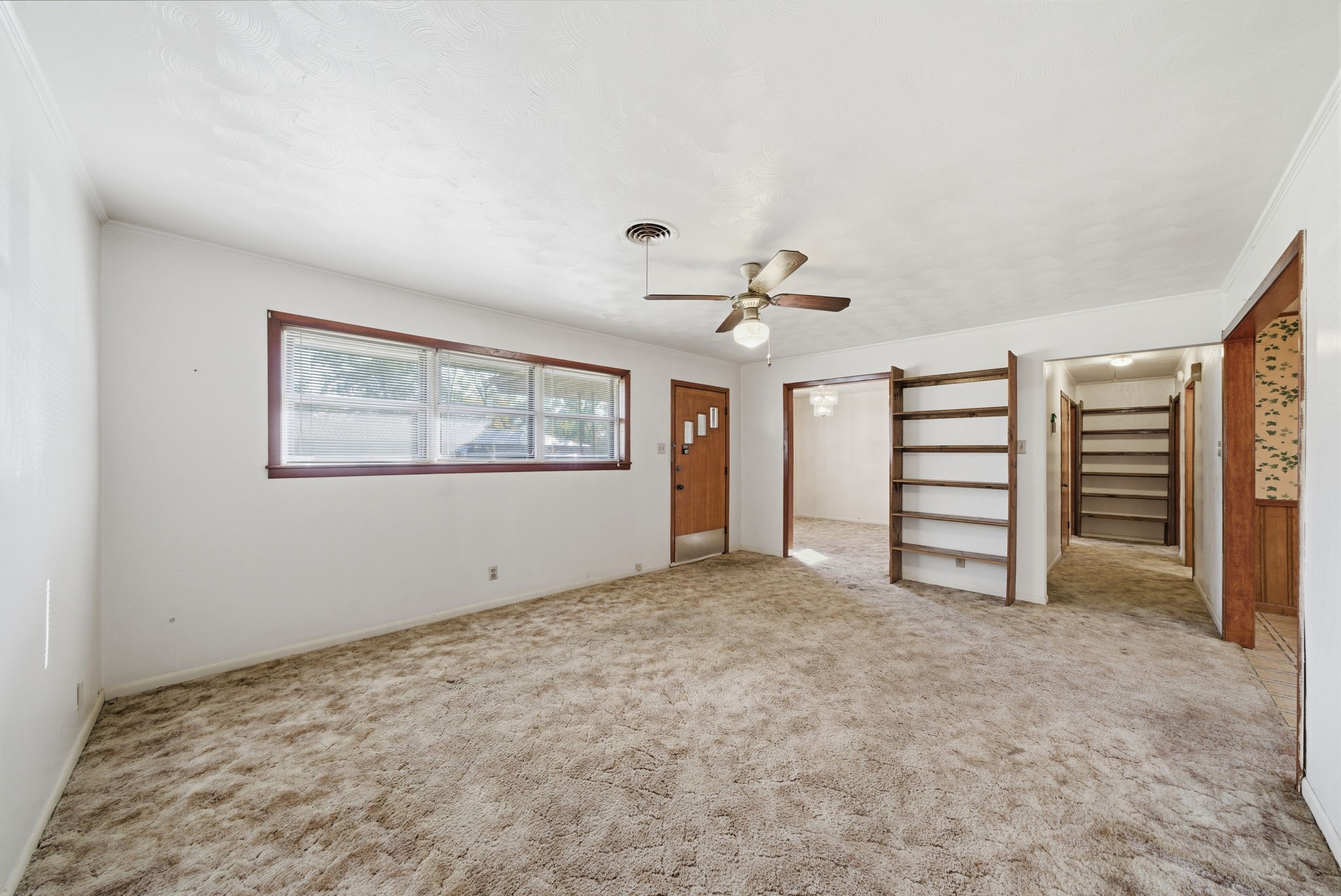 211 Frances Street Cleveland, TX 77328 - Photo 5 of 21 a view of an empty room with a window