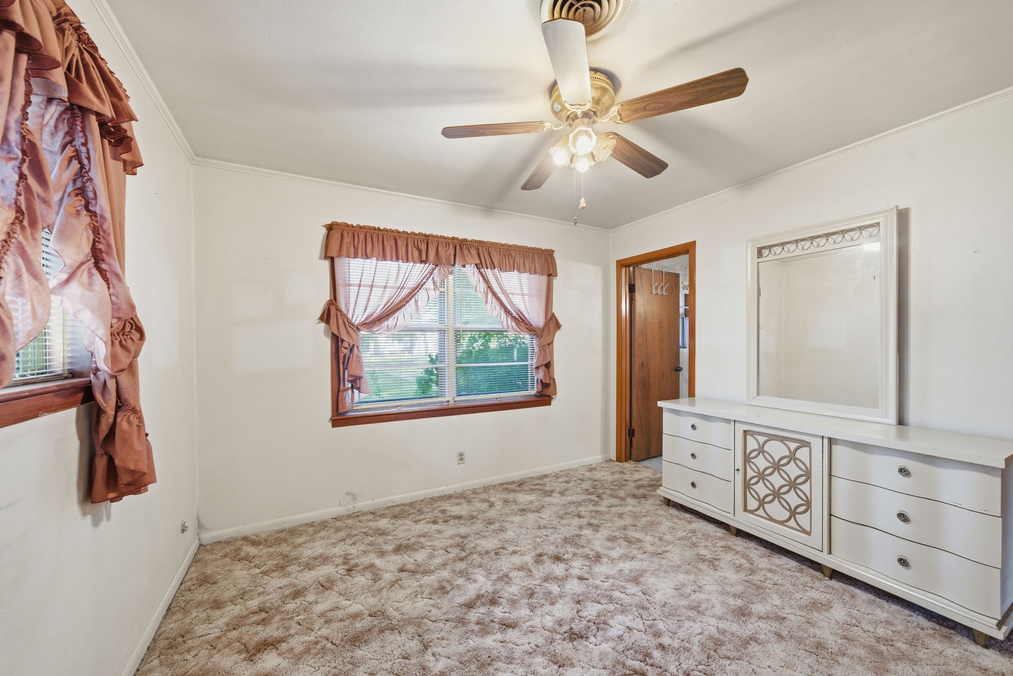 211 Frances Street Cleveland, TX 77328 - Photo 7 of 21 a view of an empty room with window and wooden floor