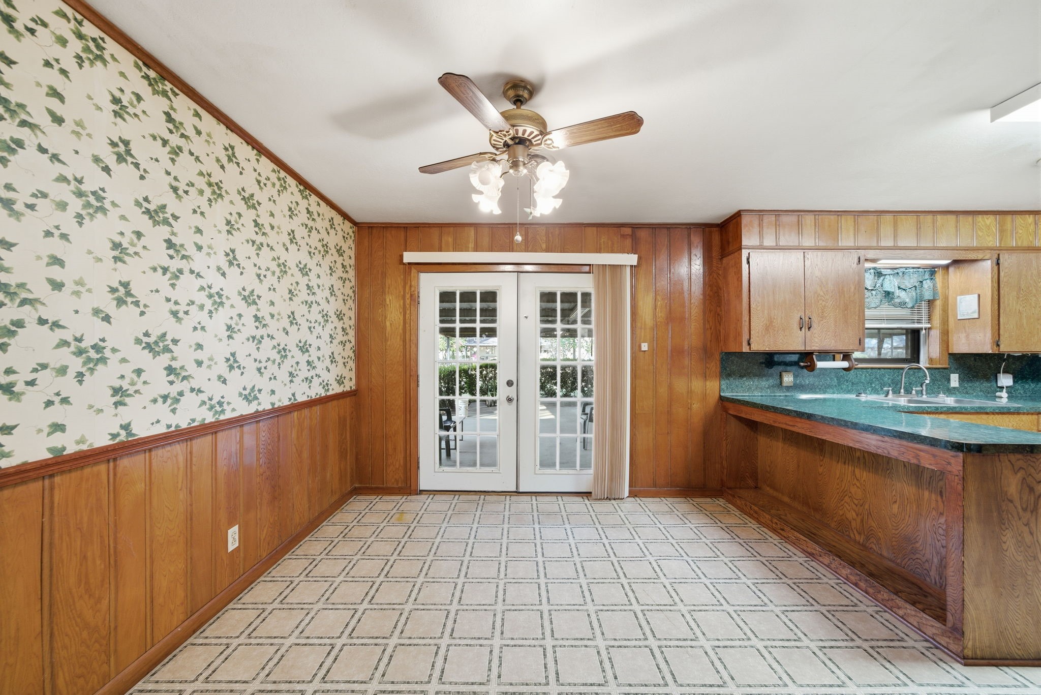 211 Frances Street Cleveland, TX 77328 - Photo 8 of 21 a view of a kitchen with a sink and a chandelier