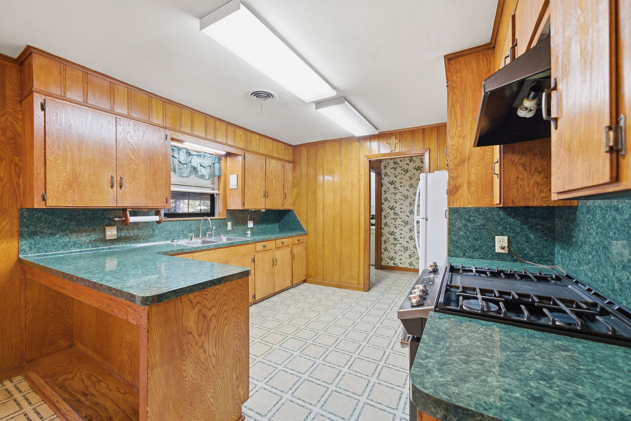 211 Frances Street Cleveland, TX 77328 - Photo 9 of 21 a kitchen with stainless steel appliances granite countertop a sink stove and cabinets