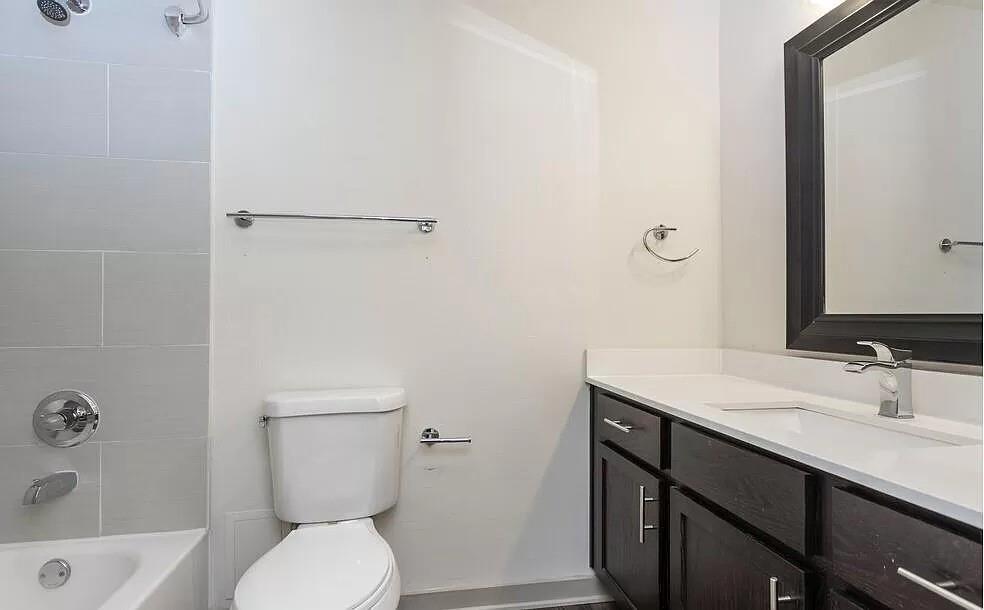 1925 Moser Avenue, Unit S1 Dallas, TX 75206 - Photo 11 of 21 a bathroom with a sink a toilet and shower