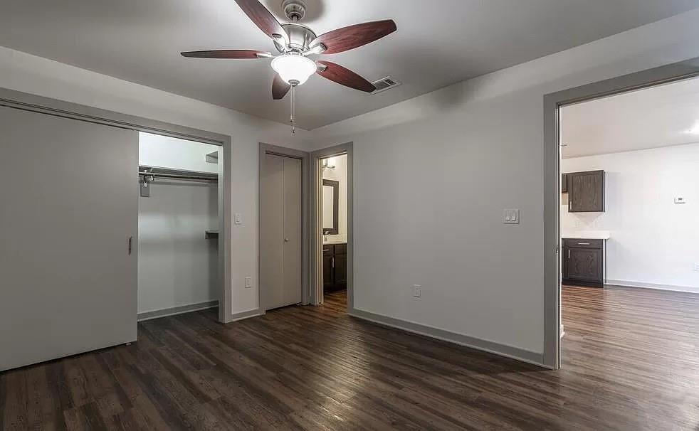 1925 Moser Avenue, Unit S1 Dallas, TX 75206 - Photo 5 of 21 wooden floor in an empty room with a window