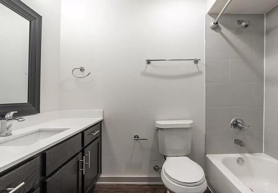 1925 Moser Avenue, Unit S1 Dallas, TX 75206 - Photo 6 of 21 a bathroom with a sink a toilet and shower