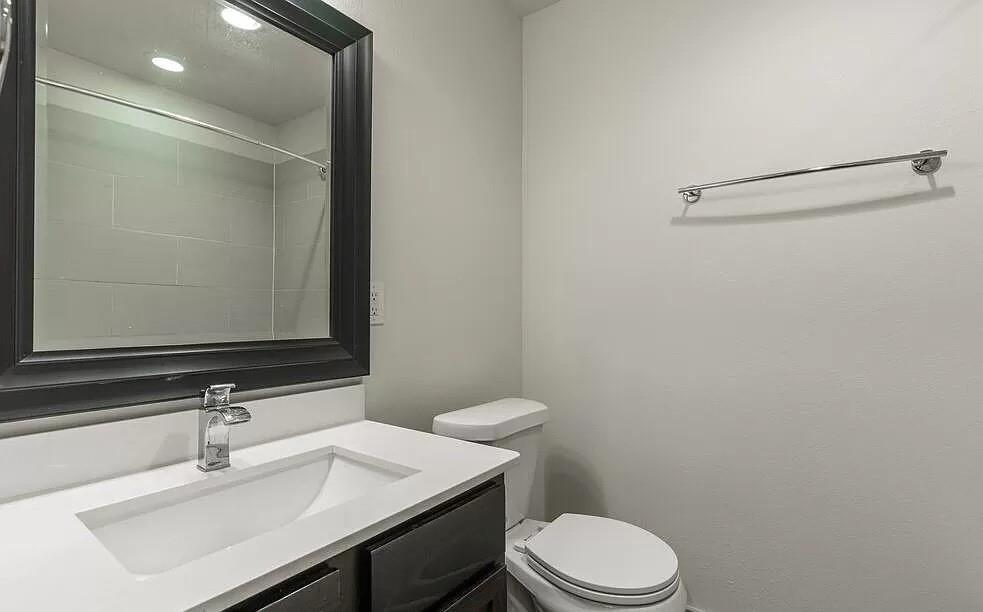 1925 Moser Avenue, Unit S1 Dallas, TX 75206 - Photo 7 of 21 a bathroom with a sink vanity mirror and toilet