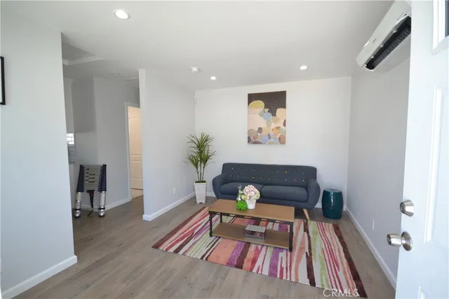 a living room with furniture and a rug