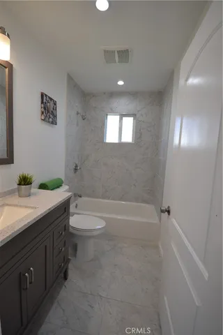 a bed room with a bed and a window