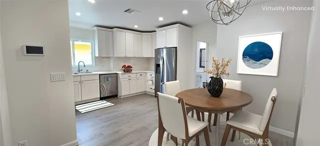a kitchen with a table and chairs in it