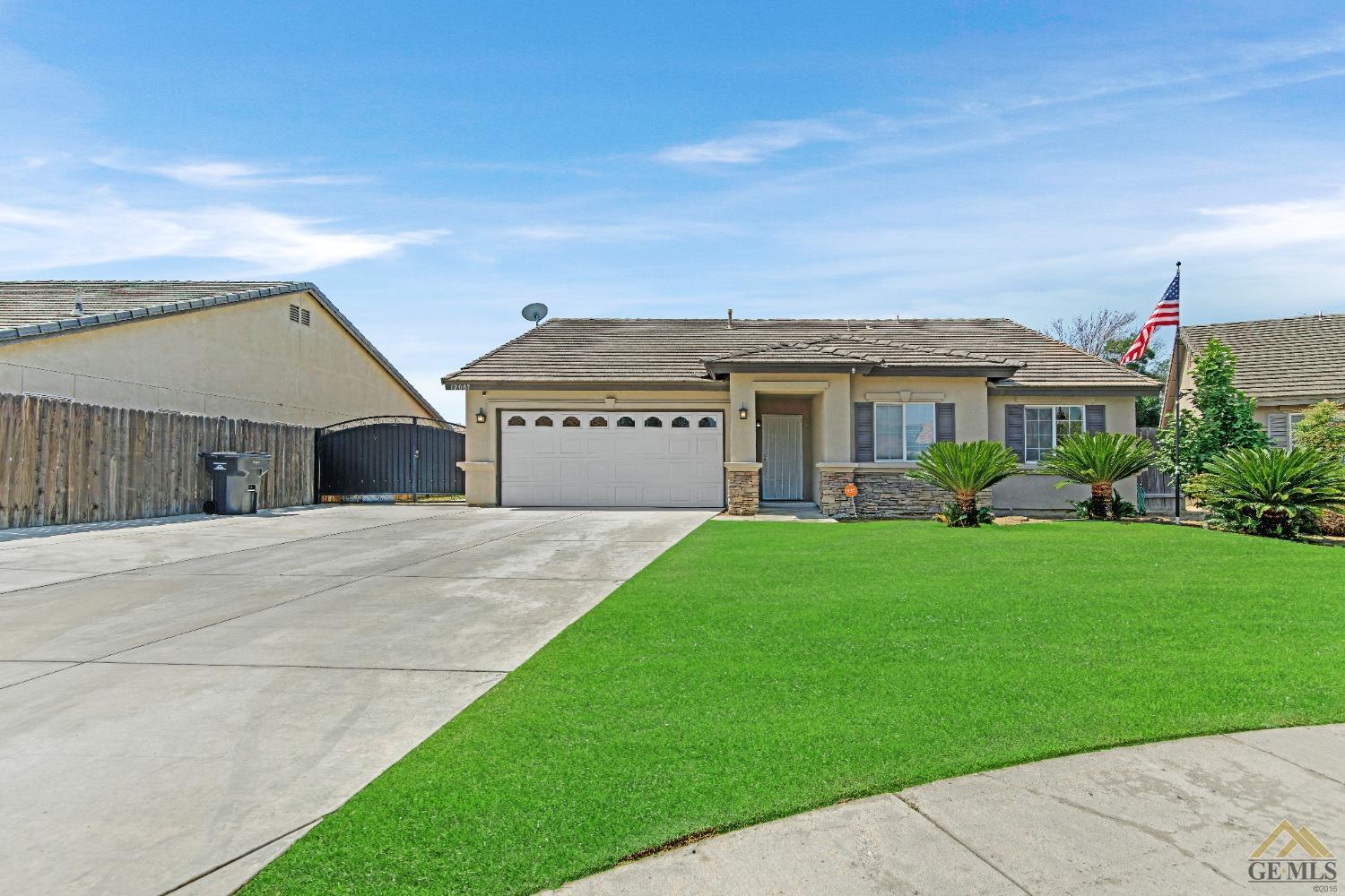 Undisclosed Address Bakersfield, CA 93312 - Photo 1 of 31 a front view of house with yard and green space