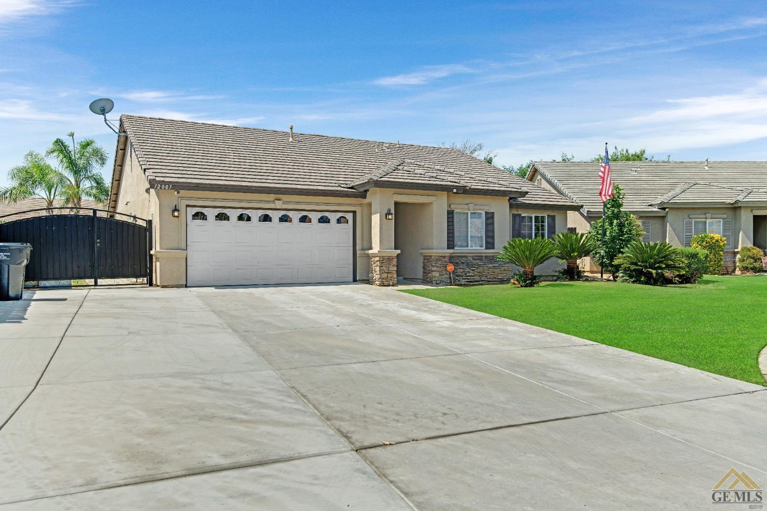 Undisclosed Address Bakersfield, CA 93312 - Photo 2 of 31 a front view of house with yard and trees around