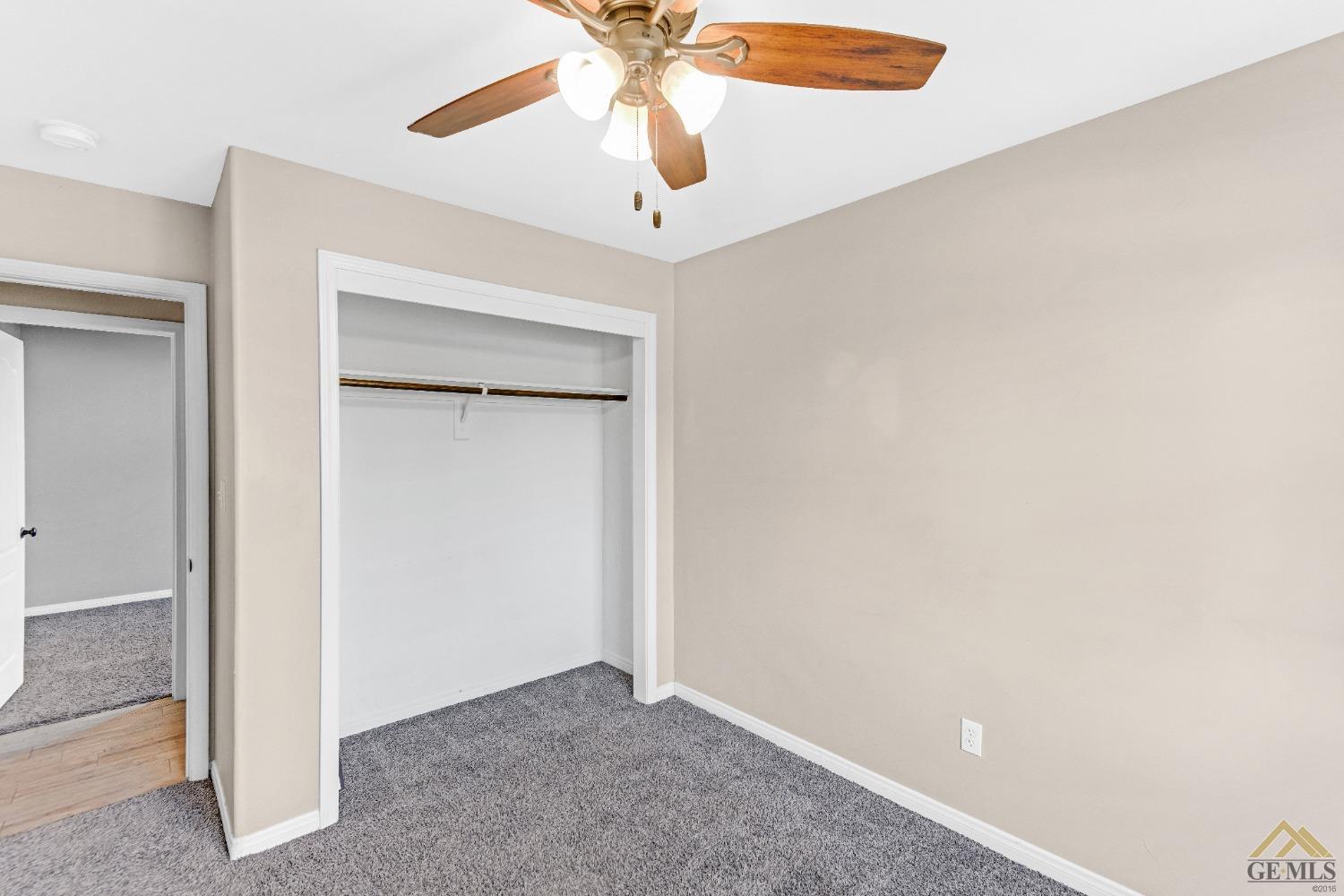 Undisclosed Address Bakersfield, CA 93312 - Photo 21 of 31 a view of an empty room with a ceiling fan