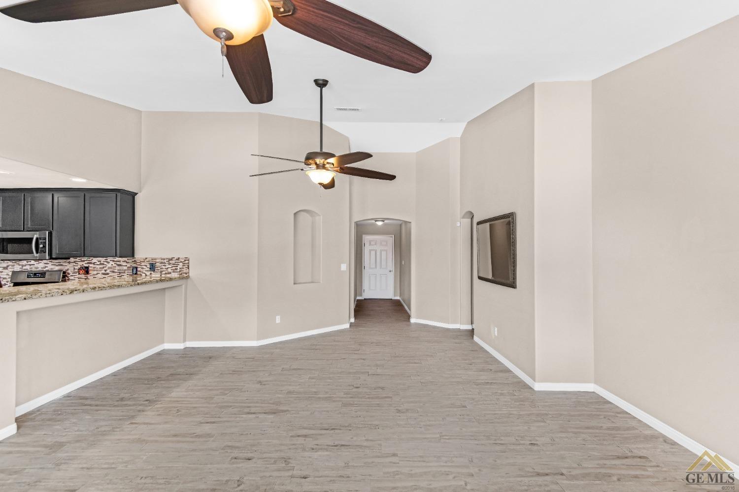 Undisclosed Address Bakersfield, CA 93312 - Photo 5 of 31 a view of a kitchen with a sink and dishwasher