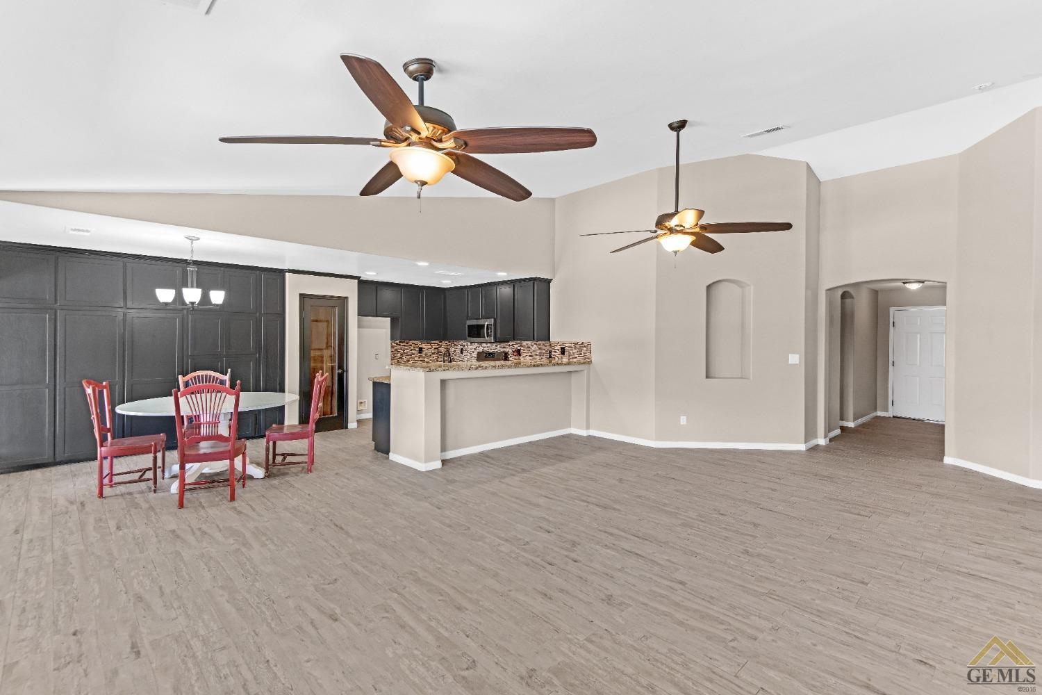 Undisclosed Address Bakersfield, CA 93312 - Photo 6 of 31 a view of a livingroom with furniture and a ceiling fan