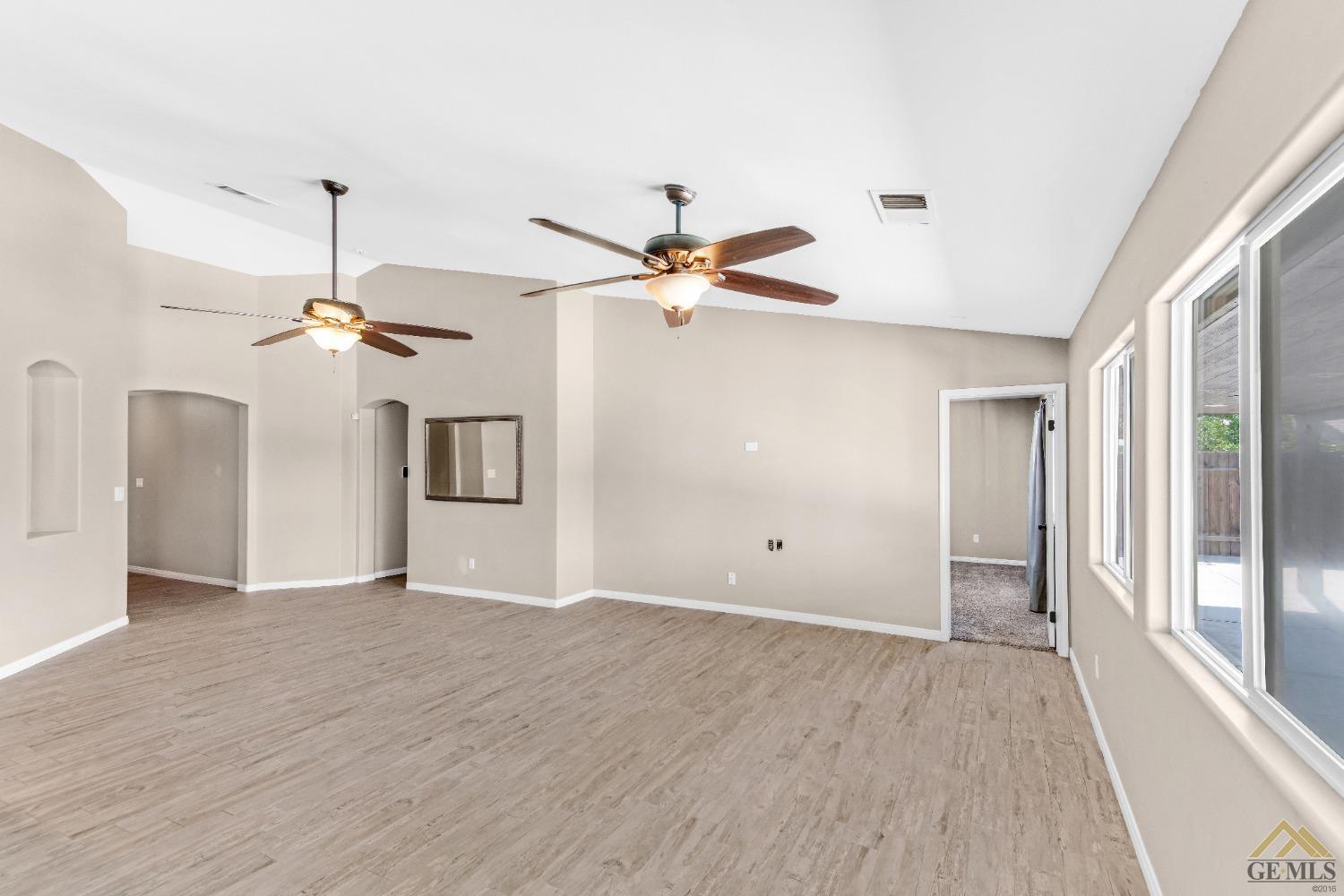 Undisclosed Address Bakersfield, CA 93312 - Photo 7 of 31 a view of a livingroom with a ceiling fan window and a ceiling fan