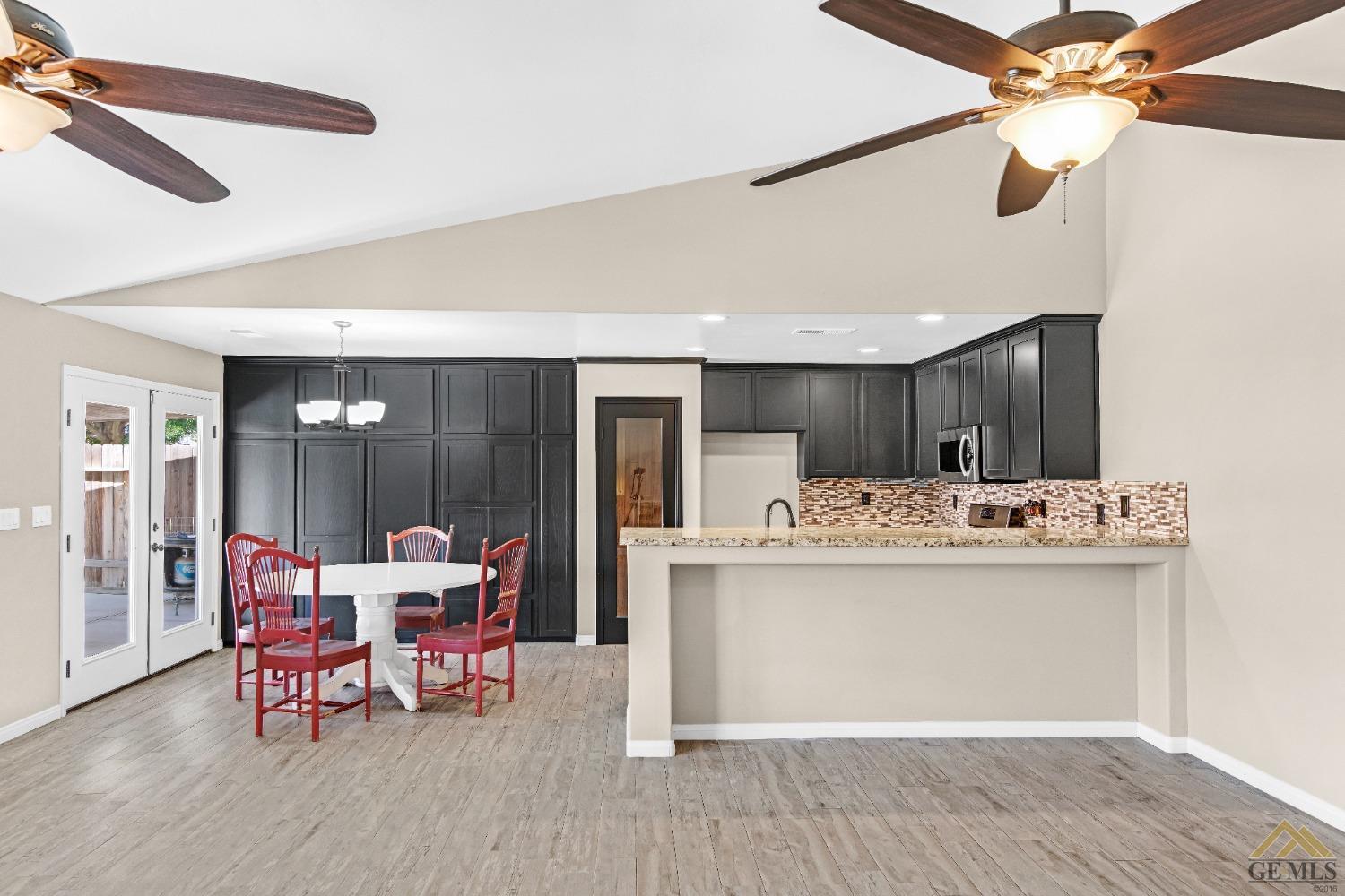 Undisclosed Address Bakersfield, CA 93312 - Photo 10 of 31 a view of a dining room with furniture window and wooden floor