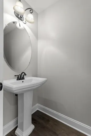 a bathroom with a sink and mirror