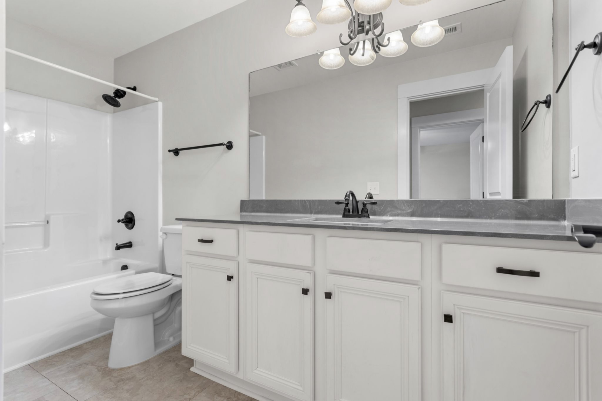 6091 Kidman Lane Spring Hill, TN 37174 - Photo 30 of 43 a bathroom with a sink a toilet and shower