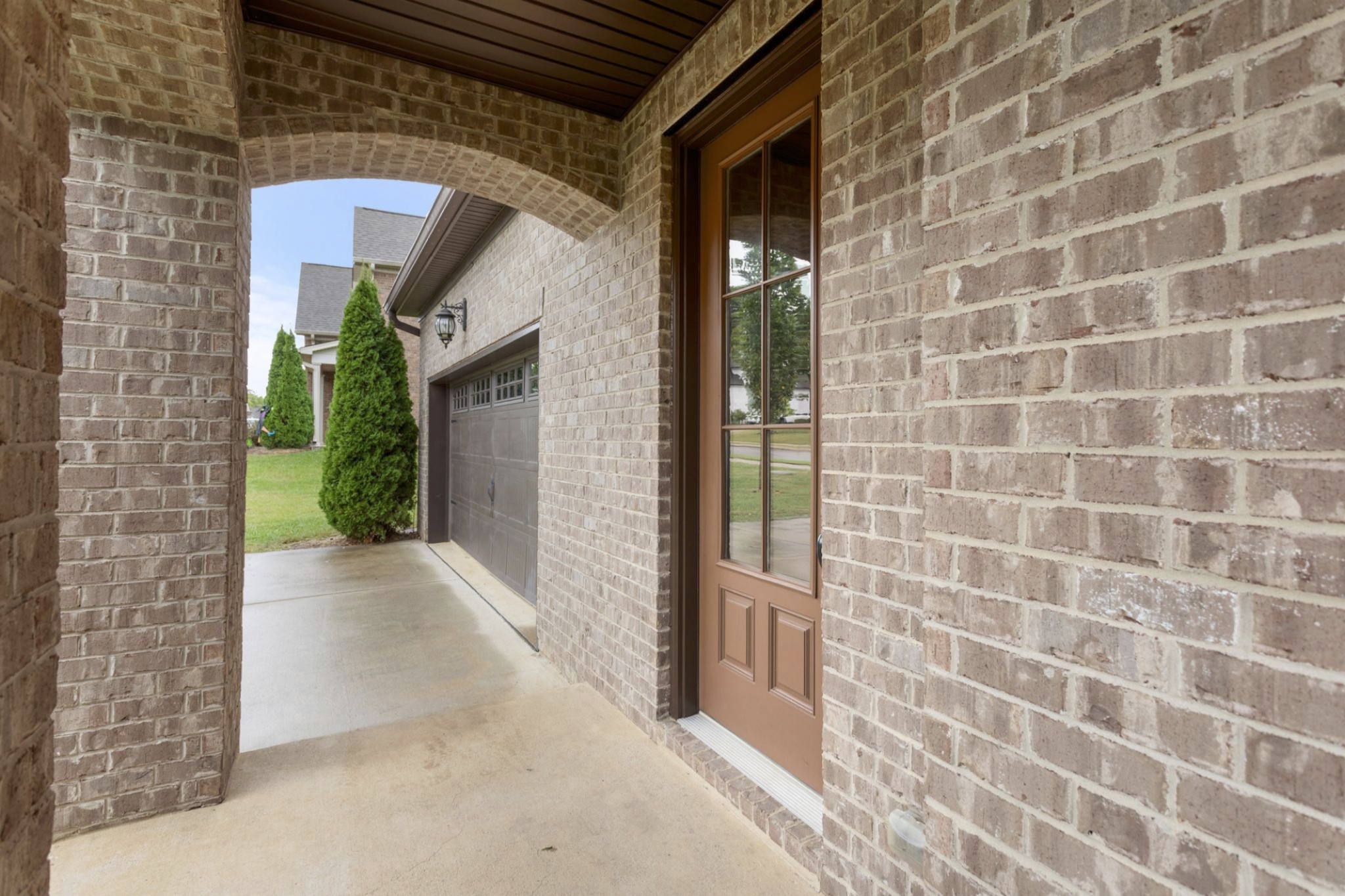 6091 Kidman Lane Spring Hill, TN 37174 - Photo 3 of 43 a view of a brick house with a glass door
