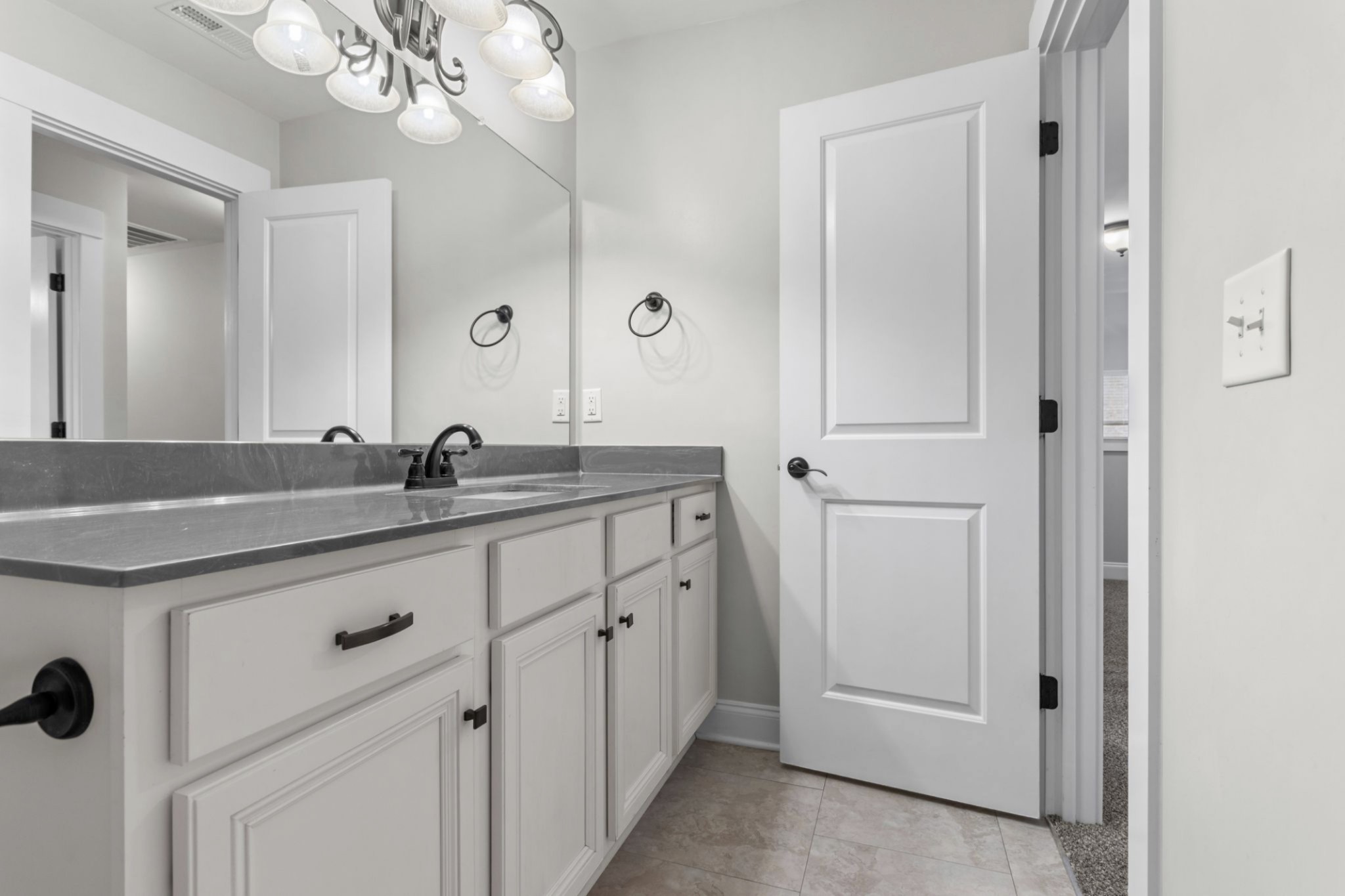 6091 Kidman Lane Spring Hill, TN 37174 - Photo 31 of 43 a bathroom with a double vanity sink and mirror