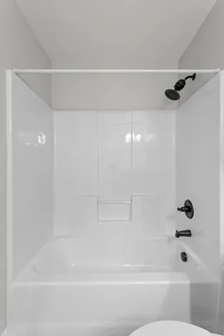 a bathroom with a shower and a bathtub