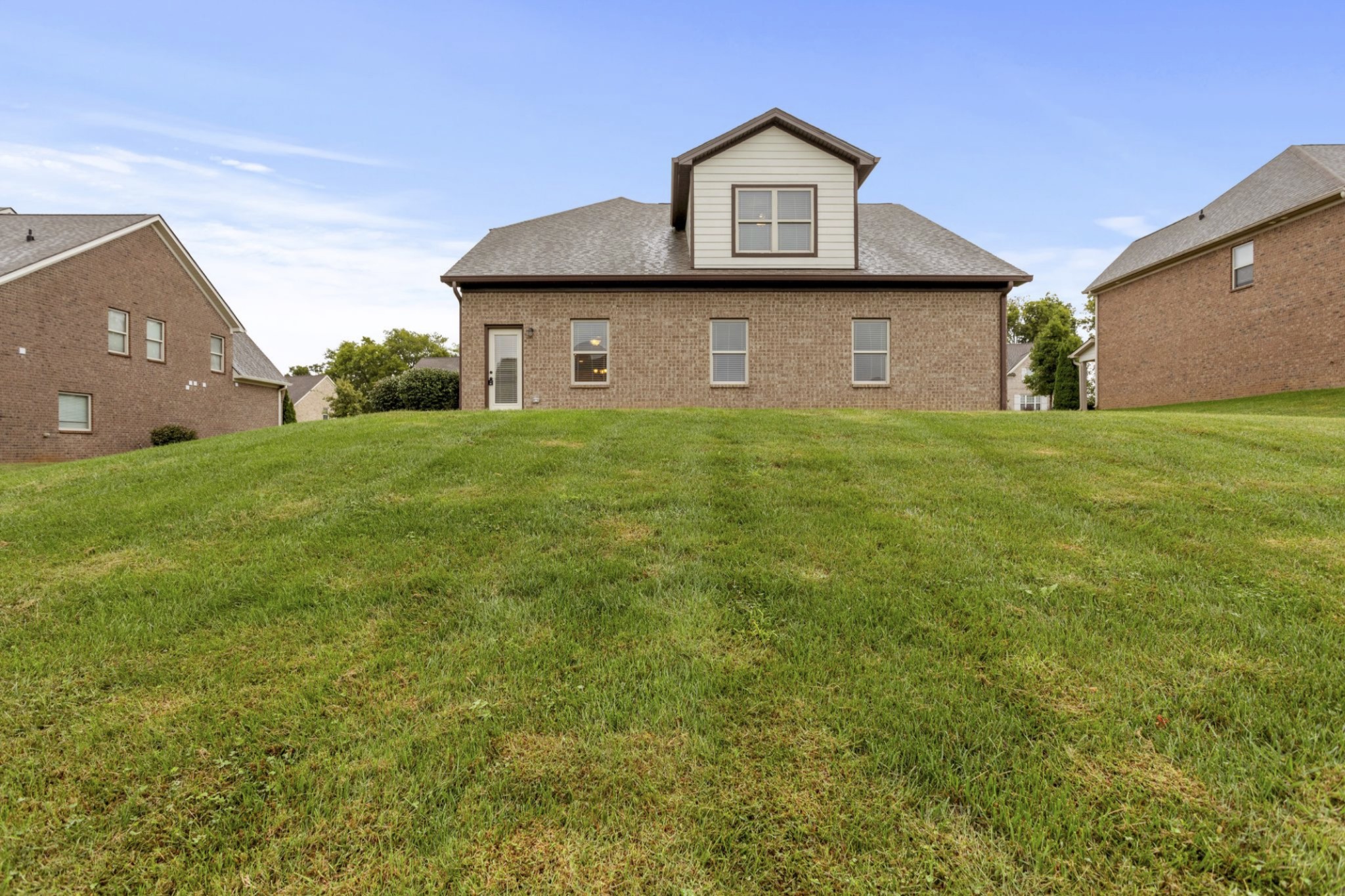 6091 Kidman Lane Spring Hill, TN 37174 - Photo 41 of 43 a front view of a house with a yard and garage
