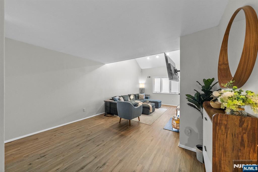 23 Bayowski Road, Unit 149 West Orange, NJ 07052 - Photo 13 of 38 a living room with furniture and a potted plant