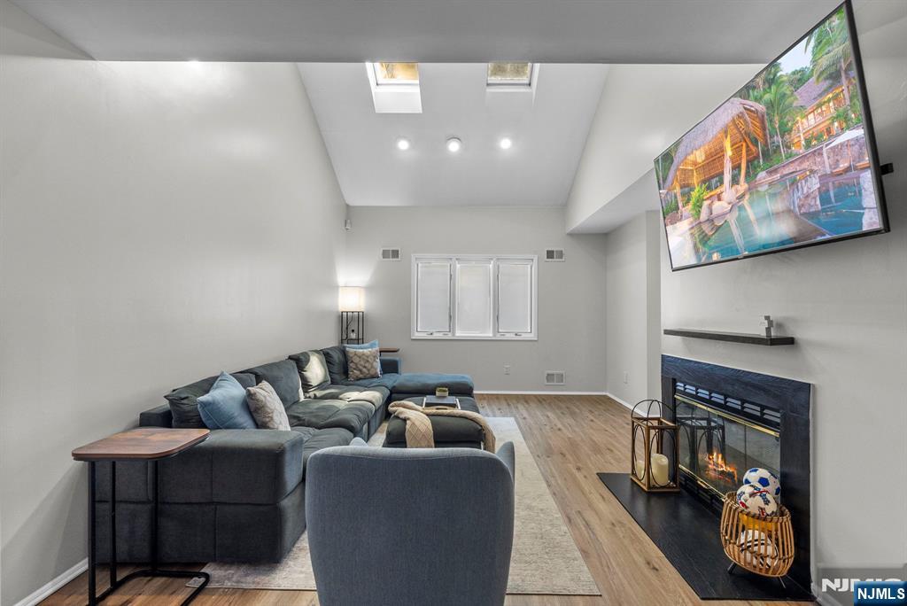 23 Bayowski Road, Unit 149 West Orange, NJ 07052 - Photo 14 of 38 a living room with furniture and a fireplace