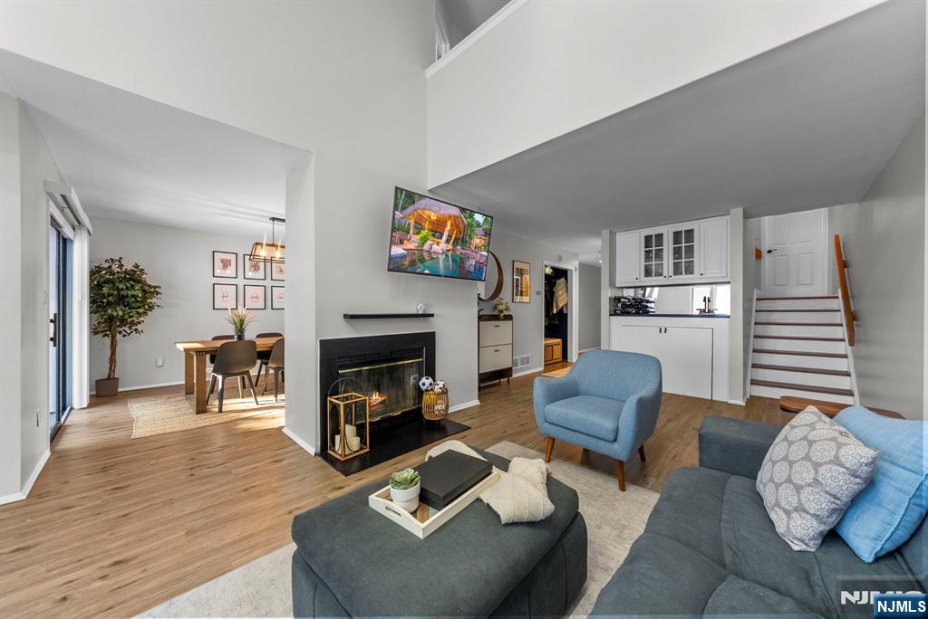 23 Bayowski Road, Unit 149 West Orange, NJ 07052 - Photo 17 of 38 a living room with furniture and a fireplace