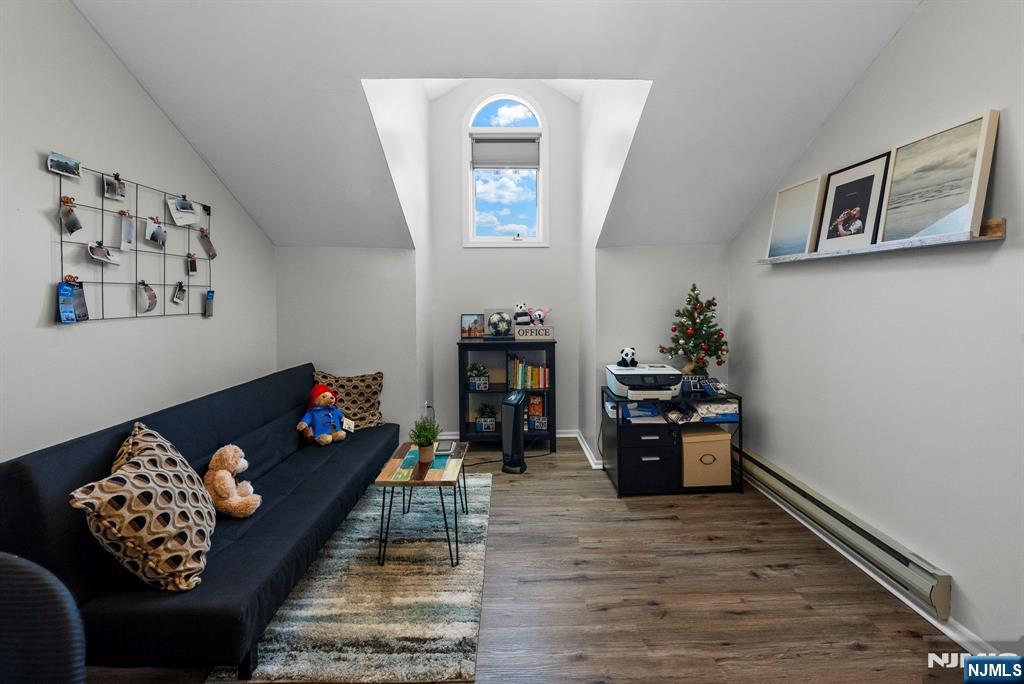 23 Bayowski Road, Unit 149 West Orange, NJ 07052 - Photo 22 of 38 a living room with furniture and painting on the wall