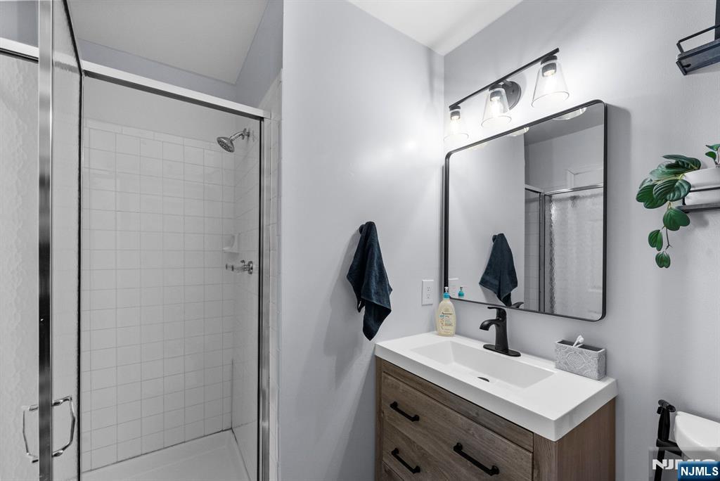 23 Bayowski Road, Unit 149 West Orange, NJ 07052 - Photo 24 of 38 a bathroom with a sink and mirror