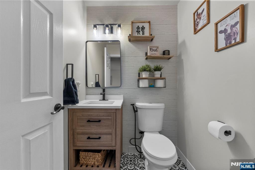 23 Bayowski Road, Unit 149 West Orange, NJ 07052 - Photo 10 of 38 a bathroom with a toilet a sink and mirror