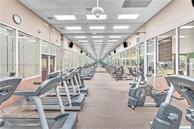 9580 Weldon Circle, Unit K110 Tamarac, FL 33321 - Photo 37 of 37 a view of a room with gym equipment
