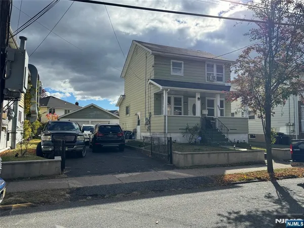 a car parked in front of a house