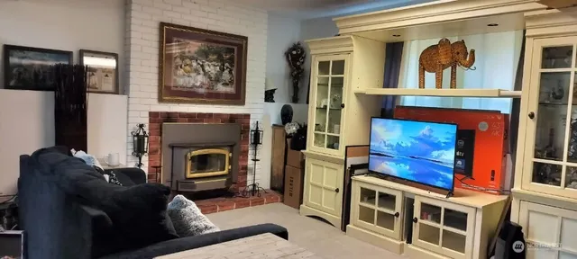 a bathroom with a granite countertop sink a mirror and a bathtub