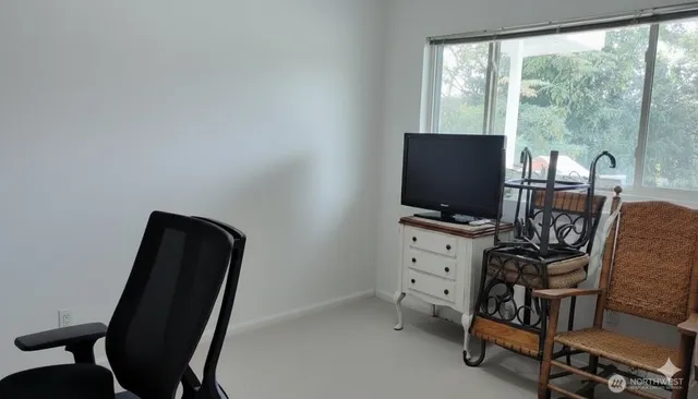 a view of a balcony with wooden floor